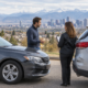 Denver drivers discussing car accident deductible reimbursement after a collision