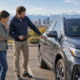 Denver driver reviewing a car after an insurer’s total-loss valuation